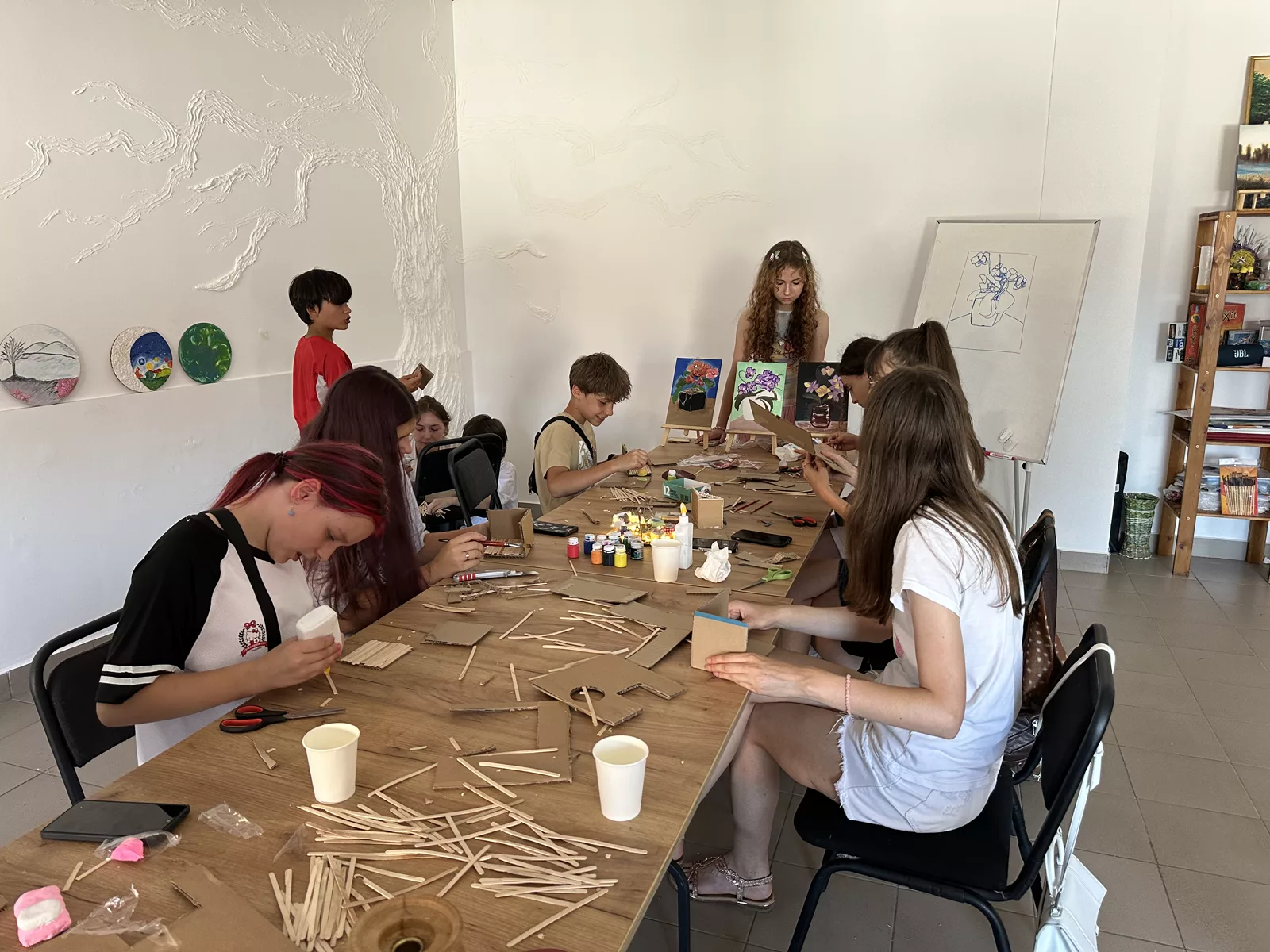 Teenagers creating handmade art together